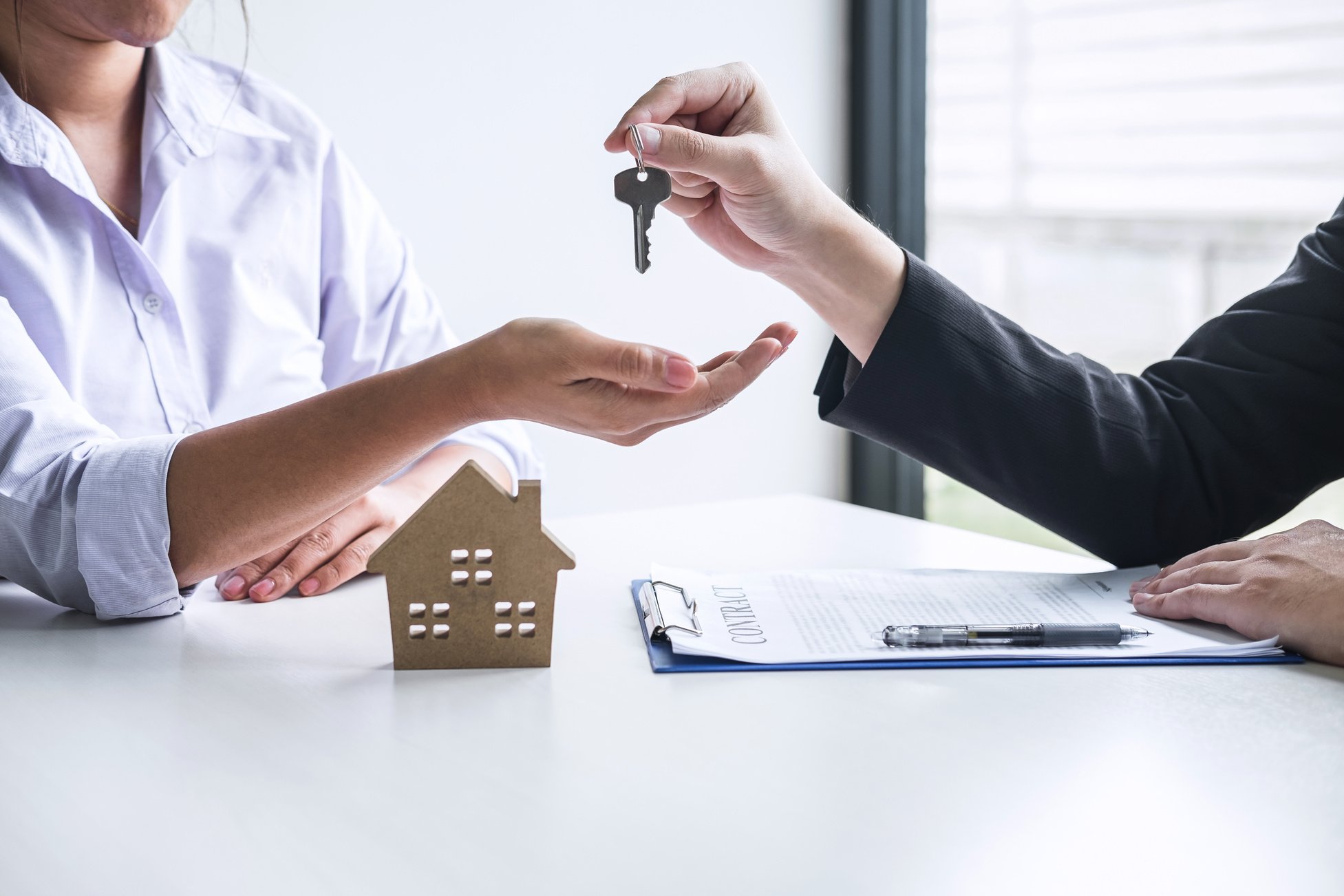 Realtor Giving Client Keys to New House